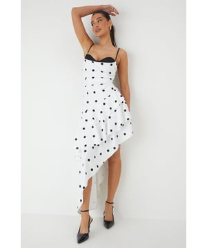 Striking sweetheart neckline with contrasting trim for a bold statement
        Asymmetric layered frill design creates dramatic movement and visual interest
        Elegant maxi length with high-low hemline for a contemporary silhouette
        Adjustable thin straps for a customised and secure fit
        Playful polka dot pattern adds a timeless charm to this occasion piece
    
    Make an unforgettable entrance in this show-stopping polka dot maxi dress from MissPap. The layered frill construction cascades beautifully to create a flattering asymmetric hemline that dances with your every move. The structured sweetheart neckline with its contrasting trim frames your dcolletage perfectly, whilst the fitted bodice cinches the waist for a feminine silhouette. Style with strappy heels and statement earrings as seen on our model for formal events such as weddings or race days. For evening soires, add a sleek clutch and a bold red lip to command attention. This versatile piece transitions effortlessly from daytime garden parties to evening celebrations - simply switch your accessories to reflect the occasion's formality. The lightweight woven fabric ensures comfort without compromising on sophistication.