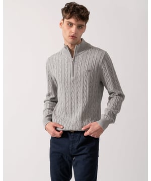 Designed in cotton with an all-over cable knit structure, this soft sweater has a regular fit and sporty half-zip collar. A preppy essential, it is detailed with our iconic GANT shield embroidered at the chest, and ribbed endings at the neck, hem and cuffs.
Regular fitHalf-zip collarCable knit structureGANT graphic embroidered at chest
 
100% Cotton
 