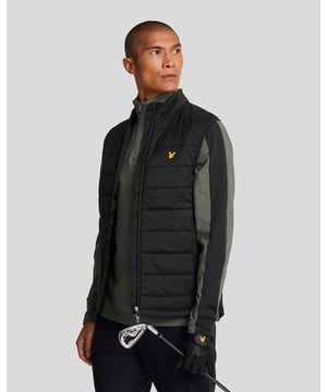 Our sophisticated Wadded Golf Gilet looks good on and off the course. Cut from a wind-proof shell, the light insulation keeps you warm without weighing you down. The elastane-blend side panels provide flexibility and stretch so you can work on your swing without restrictions.- Lockdown front zip fastening
- Overlapped zip guard 
- Zipped side pockets
- Signature Lyle &amp; Scott silicon logo
- Contrast black side panels
- Composition: Body: 42% elastomultiester, 58% polyester Panel: 18% elastane, 82% nylon