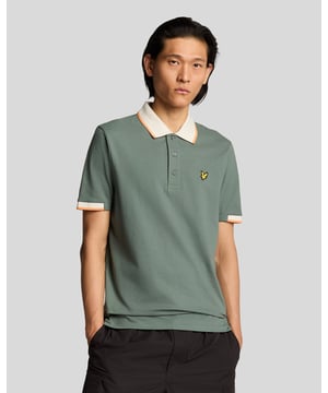 Elevate your spring menswear collection with the Half Tipped Polo Shirt, a quintessential piece that merges refinement and casual sophistication. Crafted with a premium blend of 97% cotton and 3% elastane, this shirt features meticulously designed half-tipped cuff sleeves and a stylish tipped collar, complemented by three elegant buttons. Adorned with a golden embroidered eagle on the left chest, it showcases a signature touch of luxury for the modern gentleman.

- Composition: 97% Cotton, 3% Elastane 
- Fit: Regular 
- Logo Branding: Golden embroidered eagle 
- Garment Location: Left chest 
- Styling Versatility: Perfect for both casual outings and refined gatherings 

Indulge in a garment that epitomizes elegance and versatility, making it a must-have addition to any discerning wardrobe this spring.
