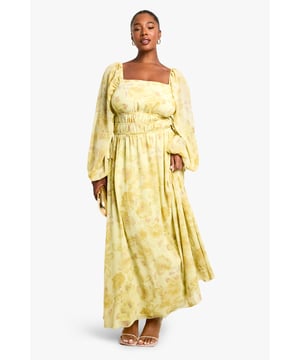 Elegant square neckline for a flattering dcolletage
        Flowing chiffon fabric with all-over pattern creates movement and drama
        Elasticated waist design offers comfortable fit and accentuates curves
        Statement balloon sleeves add contemporary flair to this classic silhouette
        Floor-sweeping maxi length perfect for making an entrance
    
    Make a striking impression in this captivating plus size maxi dress from Boohoo. The square neckline frames your dcolletage beautifully, whilst the elasticated waist creates definition and ensures all-day comfort. The billowing balloon sleeves add a touch of drama that's perfectly balanced by the flowing skirt. Style with strappy heels as seen on our model for an evening look that commands attention, or dress down with flat sandals for daytime sophistication. Add statement earrings and a clutch bag for drinks with the girls, or layer with a cropped jacket when the temperature drops. This versatile piece transitions effortlessly from summer garden parties to autumn evening events - simply adjust your accessories to suit the occasion.