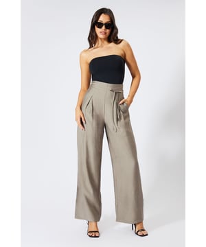 Striking paper bag waist design with self-tie belt for a customisable fit
        Wide leg silhouette creates a dramatic, flowing effect with every step
        High-waisted cut elongates the legs for a flattering profile
        Lightweight linen-look fabric offers breathable comfort for all-day wear
        Side pockets add practical functionality to this fashion-forward piece
    
    These wide leg trousers showcase MissPap's signature blend of comfort and contemporary style. The distinctive paper bag waist creates a gathered effect that cinches in your silhouette, while the flowing wide legs deliver movement and drama. Style them as seen with a one-shoulder bodysuit for casual gatherings, or dress them up with a cropped blouse and strappy heels for evening drinks with the girls. The versatile linen-look fabric transitions effortlessly between seasons-layer with an oversized blazer when temperatures drop or wear alone with a bandeau top during warmer months. Perfect for family brunches, shopping trips with mates, or casual Friday at the office, these trousers offer the ideal balance of relaxed comfort and head-turning style that MissPap devotees adore.