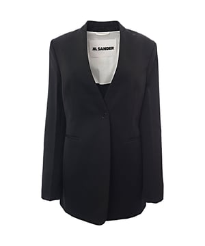 Jil Sander Women's C/O Wardrobe Pure Wool Collarless SB Tailor-Made Fitted Jacket in Black

Refined and elegant, the Jil Sander Women's C/O Wardrobe Pure Wool Collarless SB Tailor-Made Fitted Jacket in Black is a timeless piece for the modern wardrobe. Crafted from 100% pure wool, this jacket offers exceptional warmth and sophistication. The collarless design and single-breasted (SB) closure lend it a sleek, minimalist aesthetic, while the tailored fit ensures a flattering, structured silhouette. Lined with 100% viscose-rayon and body lining made from 100% cotton, the jacket feels luxurious against the skin and offers comfort throughout the day. The deep black hue enhances its versatility, making it an ideal option for both formal and casual occasions.

Material Composition: 100% Wool

Lining: 100% Viscose-Rayon; Body Lining: 100% Cotton

Color: Black

Fit: Tailor-made, fitted design for a structured, flattering silhouette

Features: Collarless design; single-breasted closure; soft wool construction with luxurious lining for added comfort

Care: Dry clean only to maintain the quality of the wool and lining.

Perfect for layering over dresses or pairing with trousers, this Jil Sander jacket is a versatile, chic statement piece for any wardrobe.