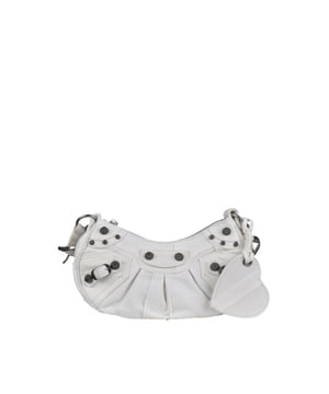 Bolso Balenciaga Cagole XS de lona vaquera blanca.Detalles metálicos plateados.Bandolera ajustable.Bolso de hombro.Cierre principal de cremallera.Espejo extraíble en forma de corazón.Dimensiones: 24 x 13 x 4,5 cm.Made in Italy.