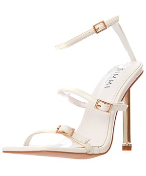 Elevate your footwear collection with the Simmi London Women's White Jessy Heeled Sandals with Buckles. These chic sandals feature a clean, crisp white color that adds a fresh, modern touch to any outfit. The stylish buckle details not only enhance the design but also offer an adjustable, secure fit for maximum comfort. The slim stiletto heel adds height and sophistication, making these sandals perfect for a night out, a special occasion, or adding a polished finish to casual wear. Whether paired with a sleek dress or your favorite jeans, these sandals are a versatile and statement-making addition to your wardrobe.

Fresh white color for a timeless, stylish look

Adjustable buckle straps for a secure and customized fit

Slim stiletto heel for added elegance and height

Sleek design that can be dressed up or down

Perfect for evening events, parties, or elevating casual looks

The Simmi London Women's White Jessy Heeled Sandals with Buckles combine modern style with a touch of sophistication, ensuring you turn heads wherever you go.