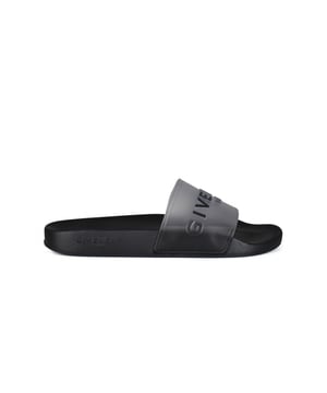 Chanclas negras Givenchy.Diseño translúcido. Logotipo negro impreso en la parte delantera.Suela plana de caucho.Made in Italy.