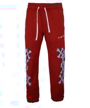 Amiri joggingbroek van rood katoen.Witte logoprint op de voorkant.Lichtblauwe botprint langs de pijpen.Elastische tailleband met trekkoorden.Elastische enkels.Zijzakken.Eén achterzak.Zwarte logopatch op de achterkant.Gemaakt in Italië.