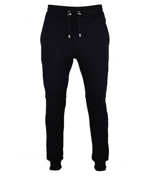 Chándal negro de algodón Balmain.Bolsillo trasero con logotipo  B  plateado.Cintura elástica con cordones.Bordes de canalé.Bolsillos laterales.