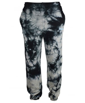 Pantalones deportivos Off-White con estampado tie-dye.Dos bolsillos.Tobillos elásticos.100% algodón.