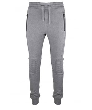 Chándal de algodón gris de Balmain.Bolsillos traseros con logotipo  B  en relieve tono sobre tono.Canesú en las rodillas.Cintura elástica con cordones.Bolsillos laterales con cierre de cremallera.Bordes de canalé.