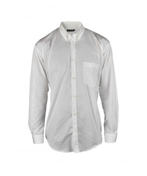 Camisa oversize Balenciaga de algodón blanco.Logotipo  BALENCIAGA  azul turquesa en la parte trasera de la camisa.Mangas largas.Bolsillo en el pecho.Cuello clásico.Cierre con botones blancos.100% algodón.