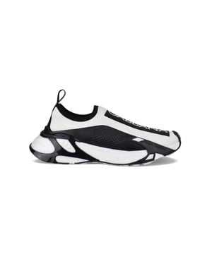 Sneakers Fast de Dolce&Gabbana.De fina malla elástica blanca.Detalles en contraste negro.Parche negro con logotipo blanco en la parte delantera.Lengüeta negra con logotipo blanco.Plantilla de piel con etiqueta del logotipo.Suela ultraligera de caucho blanco y negro.Made in Italy.