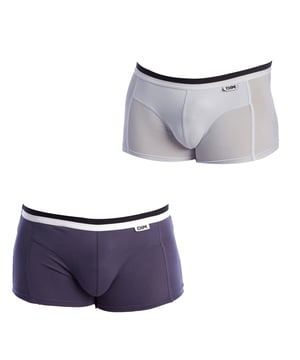 Pack-2 boxers Unno Basic by Dim.
 Elastic rubber waistband, with brand name on a fabric label on one side.
 Breathable fabric.
 Anatomical front with the ability to hold without squeezing.
 Seams seen in tone.
 Composition: 95% Cotton, 5% Elastane
 Care:
Wash at max temperature 40º.
 Do not use bleach.
 Do not use dryer.
 Do not iron.
 Do not dry clean.