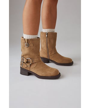 Faux suede chunky biker calf boots
        Mid-heel height between 5 and 6.5cm
        Decorative buckle and strap detailing
        Side zip closure for easy wear
        Sturdy block heel for comfort and stability
    
    Step out in style with these Faith Eostre faux suede chunky biker calf boots. The edgy design combines comfort and fashion, making them perfect for various casual outings. The mid-heel height offers a subtle lift without compromising on wearability, ideal for all-day adventures. Style these versatile boots with a flowy mini skirt and an oversized jumper for a chic autumn look, or pair them with skinny jeans and a leather jacket for a classic biker-inspired ensemble. These boots are your go-to choice for family gatherings, weekend brunches, or casual shopping trips. Their robust construction and timeless appeal ensure they'll be a staple in your wardrobe for seasons to come, effortlessly transitioning from day to night with their adaptable style.