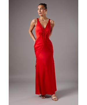 Elegant satin maxi dress with intricate lace trim detailing throughout
        Flattering plunge neckline at both front and back for a sophisticated silhouette
        Figure-enhancing design with lace panels that create visual interest
        Floor-sweeping length perfect for formal occasions
        Sleek, bias-cut silhouette that gracefully skims the body
    
    This stunning Coast maxi dress combines timeless elegance with contemporary design. The luxurious satin fabric catches the light beautifully as you move, whilst the delicate lace trim adds a romantic touch to the plunging neckline and cascades down the length of the dress. Perfect for weddings, race days or black-tie events, this gown makes a refined statement. Style with strappy metallic heels as shown and statement earrings for maximum impact. For cooler evenings, layer with a tailored blazer or delicate pashmina. The bias-cut silhouette creates a flattering drape that will ensure you command attention at any formal gathering, whilst the back detail adds interest from every angle. A truly sophisticated choice for the discerning occasion-wear shopper.
