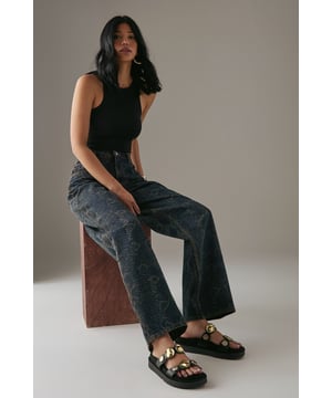 Faux leather double strap design with distinctive metal disk detailing
        Comfortable footbed construction for all-day wear
        Low heel height between 2.5-4.5cm offers subtle elevation
        Secure adjustable straps for a customised fit
        Durable synthetic outsole provides reliable grip and traction
    
    The Rhonda mules from Faith combine contemporary style with everyday comfort. These versatile sandals feature eye-catching metal disk detailing that adds a touch of sophistication to casual outfits. As shown in the images, they pair beautifully with wide-leg trousers for an effortlessly chic look. The low heel provides just the right amount of height whilst maintaining walkability, making these mules perfect for family gatherings, weekend brunches or casual shopping trips. The footbed construction moulds to your feet for lasting comfort throughout the day, whilst the double strap design ensures they stay securely in place. Style them with cropped jeans and a crisp white shirt for daytime outings, or match with a flowing maxi dress for relaxed summer evenings.