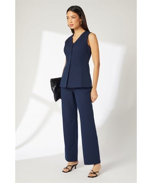 Slim fit cigarette trousers with a sleek, tailored silhouette
        Elegant straight-leg design that falls gracefully to the ankle
        Practical side pockets for essential items
        Smooth woven fabric with slight stretch for comfortable movement
        Versatile design suitable for professional settings and beyond
    
    These sophisticated Principles cigarette trousers offer the perfect foundation for your workwear wardrobe. The slim fit creates a refined silhouette whilst maintaining comfort throughout the day, thanks to the fabric's subtle stretch. Style with a coordinating waistcoat or button-up sleeveless top as shown for a contemporary professional ensemble. The straight-leg design pairs beautifully with kitten heels or pointed flats for office days, whilst transitioning effortlessly to after-work gatherings when accessorised with statement jewellery. These trousers can be dressed up with a crisp blouse and blazer for important meetings or presentations, ensuring you maintain a polished appearance. Their timeless design makes them a wardrobe staple that will serve you season after season, offering endless styling possibilities for the modern working woman.