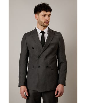 Classic double-breasted design with six-button front for a distinguished silhouette
        Tailored fit that defines the shoulders while offering comfortable movement
        Distinctive herringbone pattern woven throughout for subtle texture and visual interest
        Notched lapels with clean lines that enhance the formal aesthetic
        Two front flap pockets with neat stitching detail for practical functionality
    
    This Burton herringbone double-breasted jacket presents a refined option for the gentleman who appreciates timeless style. The tailored silhouette shapes the body without restricting movement, making it ideal for long days at the office or special occasions. Style with matching trousers as shown for a complete suit that commands respect in professional settings, or break the look apart with dark denim for smart-casual gatherings. The versatile herringbone pattern adds character without overwhelming, perfect for sporting events or an evening at your local with friends. Complete the ensemble with a crisp white shirt and solid tie as modelled for classic appeal, or experiment with subtle patterns for a contemporary twist. This jacket transitions seamlessly from important meetings to after-work drinks, offering the confidence of traditional British tailoring with modern sensibility.