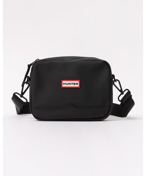 The Verny Crossbody Bag is crafted from a water-resistant rubber touch polyester fabric. Compact yet highly functional, the crossbody is an ideal size for carrying everyday essentials. With an adjustable matte webbing strap that can be worn over the shoulder or as a crossbody, the green bag comes with a moustache detail and a waterproof zip closure. Finished with our signature Hunter silicon logo on the front and embossed hardware details.



Certified Vegan
100% Water-resistant polyester exterior with polyurethane coating
External waterproof zip
Lightweight
Adjustable webbing strap for carrying
Hunter silicon label
Height 16cm, depth 8.5cm, width 21cm, strap length (when full extended) 130cm



Material: 100% Polyester with polyurethane coatingStrap: 100% Polyester webbingLabel: 100% SiliconZip: VislonLining: 100% Polyester
 
HXRU0023242
 
