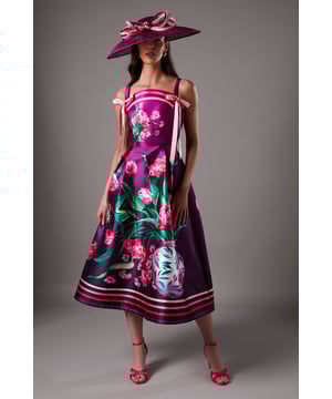 Elegant square neckline with decorative tie detail for a feminine touch
        Bold floral print design with contrasting border detail at the hem
        Flattering midi length with a structured A-line silhouette
        Comfortable shoulder straps and fitted bodice for excellent support
        Fully lined for smooth drape and comfortable wear throughout the day
    
    Make a statement at your next special occasion with this striking Coast midi dress. The eye-catching floral print creates a dramatic visual impact whilst the square neckline with delicate tie detailing adds a touch of sophistication. The structured A-line silhouette flatters the figure beautifully, creating an hourglass effect that's both elegant and contemporary. Style with coordinating accessories as shown - a wide-brimmed hat and statement earrings for race day glamour, or pair with a tailored blazer and clutch for wedding guest perfection. The midi length offers versatility for various formal settings, whilst the back view reveals a clean, classic line that's just as impressive as the front. Complete your ensemble with strappy heels in a complementary shade for a polished, head-turning look that reflects true British elegance.