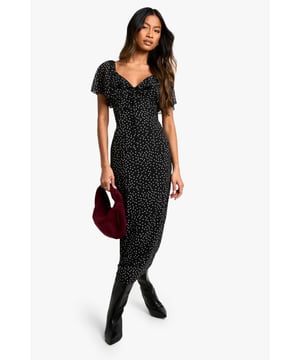 Chiffon midi dress with allover polka dot pattern
        Flattering sweetheart neckline for a feminine touch
        Short flutter sleeves add movement and charm
        Figure-hugging silhouette accentuates curves
        Versatile length suitable for various occasions
    
    Make a statement at your next formal event with this enchanting polka dot midi dress from Boohoo. The chiffon fabric drapes beautifully, creating a graceful silhouette that's perfect for weddings, races, or graduations. The sweetheart neckline and flutter sleeves add a romantic flair, while the fitted bodice and flowing skirt balance sophistication with allure. Style it with strappy heels and a clutch for an elegant ensemble, or dress it down with ankle boots and a leather jacket for a chic day-to-night look. This versatile piece can be accessorised to suit any occasion, making it a must-have addition to your wardrobe. Whether you're attending a garden party or a cocktail soire, this dress will ensure you're always dressed to impress.