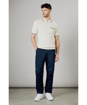 Half elasticated waistband for comfortable all-day wear
        Slim fit design offers a modern, streamlined silhouette
        Practical back pockets with button closure for secure storage
        Clean-cut finish with no visible cuffs for a sleek appearance
        Versatile woven fabric that maintains its shape throughout the day
    
    These half elasticated waist chinos strike the perfect balance between comfort and style. The slim fit contours to your body without feeling restrictive, making them ideal for both casual outings and relaxed work environments. Pair them with a knitted polo shirt as shown for a smart-casual look that works brilliantly for weekend pub visits or family gatherings. The clean lines and classic design make these chinos a wardrobe essential that transitions effortlessly from daytime errands to evening socialising. Team with white trainers for a fresh, contemporary finish, or dress them up with desert boots for more formal occasions. These Burton chinos offer the reliability and timeless appeal that complements an active lifestyle without compromising on style.