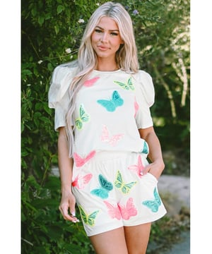 Our styles are designed with a trendy fitted look in mind following an international size standard. For the best fit we suggest choosing one size up from your usual. Be sure to check our sizing chart to find your perfect match!
  White Colorful Sequin Butterfly Puff Sleeve Top Shorts Set
  Unique and stylish sequined lounge set
  Stylish puff sleeves for a trendy look
  Elastic waistband for a comfortable fit
  Perfect ensemble for a fun and fashionable appearance
  Captivating patterns and textures
Material: 95% Cotton 5% Elastane