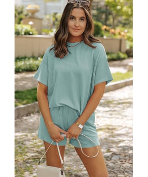 Our styles are designed with a trendy fitted look in mind following an international size standard. For the best fit we suggest choosing one size up from your usual. Be sure to check our sizing chart to find your perfect match!
  Two
  piece set includes a tee and shorts
  Made from ribbed knit fabric for a unique texture
  Soft and comfortable for hot days
  Loose fit design
  Can be worn separately
Material: 75% Polyester 20% Viscose 5% Elastane