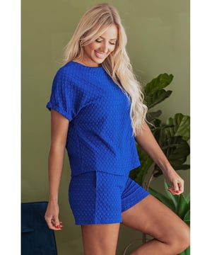Our styles are designed with a trendy fitted look in mind following an international size standard. For the best fit we suggest choosing one size up from your usual. Be sure to check our sizing chart to find your perfect match!
  Jacquard textured fabric for a unique wear
  Loose fit tee with cuffed sleeves
  Decorative button details
  Matching shorts with elastic waist
  Side pockets for convenience
  Suitable for various occasions
Material: 95% Polyester 5% Elastane