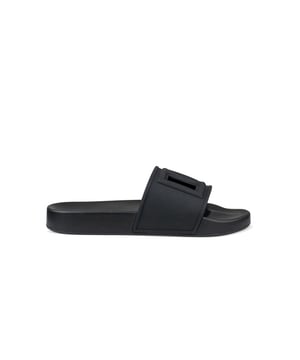 Chanclas Dolce & Gabbana de goma negra.Logotipo en relieve en el centro con aberturas.Suela plana.Made in Italy.