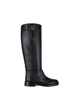Botas Valentino VLogo The Bold Edition en piel de becerro negra.Correa con adorno VLogo Signature y hebilla con acabado metálico dorado.Puntera redondeada.Suela plana de 3 cm.Made in Italy.