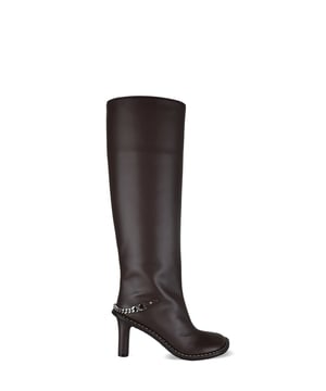 Botas de tacón Stella McCartney Ryder marrones.Fabricadas en piel vegana.Detalle de cadena plateada en el talón.Cierre de cremallera en el interior.Puntera cerrada, redondeada y angulosa.Tacón grueso de 8,5 cm.Made in Italy.
