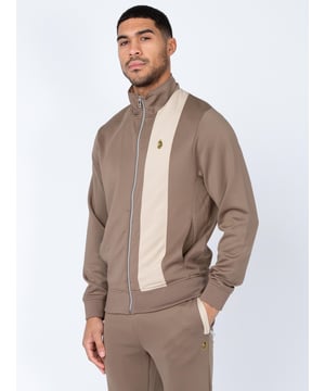 When it comes to sportswear staples, LUKE have you covered with this zip through sweat. Crafted from a stretchy tricot, it is detailed with a funnel neck and soft rib trims throughout. It features a cut and sew contrast vertical panel and is complete with the brands iconic lion head embroidery on the left chest.