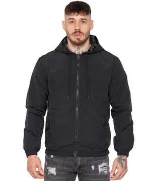 The Enzo Milano Men's Windbreaker Jacket offers a sleek, lightweight design with a regular fit. Made from durable tech fabric, it features a full zip, adjustable drawstring hood, and elasticated cuffs for added comfort and protection. With two concealed zip pockets, a single inner pocket, and an elasticated hem with a drawcord toggle, this water-Repellent jacket is perfect for everyday wear in light rain or windy conditions. Finished with the signature Enzo Milano rubber badge for a stylish touch.