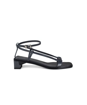 Sandalias Linea Anest Collective de piel lisa grise.Fina tira trasera cruzada en el tobillo con cierre plateado. Punta cuadrada.Tacón cuadrado de 3,5 cm.100% cuero.Made in Italy.
