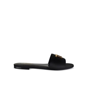Tom Ford Sandalen aus schwarzem Leder.Geprägtes „TF“-Logo aus goldfarbenem Metall auf dem vorderen Riemen.Offene runde Spitze.Sohle aus Leder.Made in Italy.
