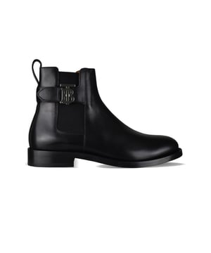 Botas Chelsea Burberry negras de piel de becerro pulida. Refuerzo lateral elástico.Correa con logotipo plateado en la parte exterior del tobillo.Correa trasera con herrajes con logotipo y cierre en relieve.Forro de piel de becerro granulada marrón claro.Tira en el talón.Suela de cuero.Punta redonda.Made in Italy.