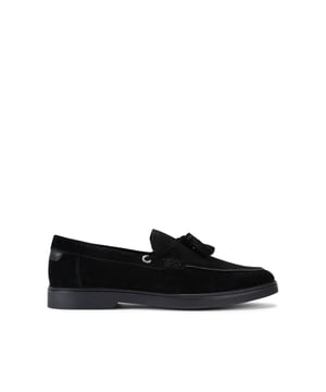 The KG Kurt Geiger Ronan is a slip-on shoe crafted from a black suede leather. There are antiqued brass branded eyelets on each side with a tassel detail on the toe.