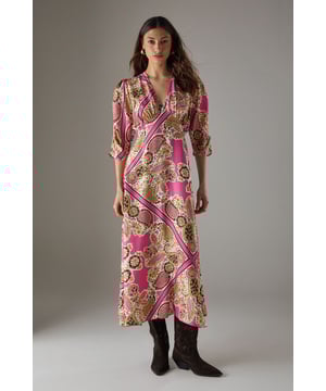 Striking paisley print midi dress with elegant V-neckline
        Feminine puff sleeves with three-quarter length for a flattering silhouette
        Flowing viscose fabric that drapes beautifully around the body
        Midi length design perfect for versatile styling options
        Subtle waist definition that enhances the feminine shape
    
    This Warehouse paisley midi dress captures confident femininity with its bold print and flattering cut. The V-neckline frames the dcolletage beautifully, while the puff sleeves add a touch of romantic charm to this contemporary piece. Style with western boots for an edgy daytime look as shown, or switch to flat sandals for relaxed weekend brunches. The flowing viscose fabric moves gracefully with every step, making it ideal for family gatherings or casual social events. For cooler days, layer with a cropped denim jacket and add statement earrings to complement the distinctive pattern. This versatile dress transitions effortlessly from day to evening - simply swap your casual footwear for block heels and add a clutch bag for dinner dates. The midi length offers the perfect balance of comfort and style for the modern British woman.