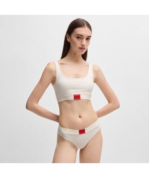 Womens HUGO Stretch-cotton Bralette with red logo label.A signature bralette by HUGO. Featuring a red logo label on the band  this design is crafted in stretch jersey for comfort.  This product is partly made with organic cotton.- Exposed underbust elastic- HUGO red label- Main material: 93% Cotton  7% Elastic synthetic fibre.  Underbust band: 57% Polyamide  30% Polyester  13% Elastic synthetic fibre.  Machine washable.- Ref: 50503099-101