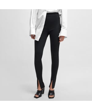 Womens NAOMI x BOSS Leggings in stretch jersey with zip hems in black.Super-stretch jersey leggings by BOSS Womenswear  featuring zipped hems for adjustable styling. The bi-stretch  anti-crease fabric offers heightened performance and comfort. Added bacteria-resistant finish for a fresh feel on busy days. Part of an exclusive capsule  co-created with Naomi Campbell  designed with elegance  confidence  and on-the-go ease in mind.Main material: 73% Polyamide  27% Elastane.  Waistband: 40% Polyester  35% Polyamide  25% Elastane.  Machine washable.Ref: 50510786-001