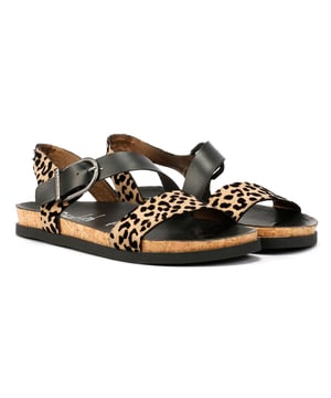 Women's sandals with a faux leather upper for a sleek, cruelty-free style. Designed with a cushioned footbed for all-day comfort and support. Features an adjustable buckle closure for a secure and customizable fit. These vegan-friendly sandals combine comfort and contemporary design.
