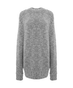 The RAEY Women's Bouclé Raglan Jumper in Grey offers a blend of luxury and comfort. Made from a soft, high-quality mix of 93% merino wool and 7% polyamide, this jumper provides warmth and breathability, making it perfect for cooler days. The bouclé fabric adds a textured, sophisticated finish, while the raglan sleeves offer a relaxed, modern silhouette. The versatile grey color makes it easy to style with a range of outfits, from casual jeans to tailored trousers. Elevate your knitwear collection with this timeless, elegant piece.