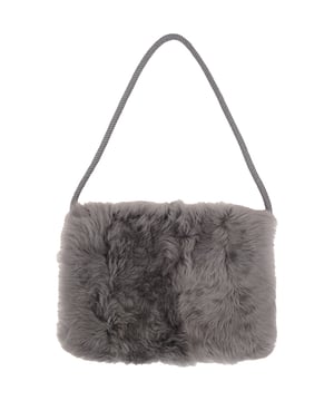 100% Shearling. London-based label Raey crafts this muff from plush shearling stitched with a zipped pocket for safe storage