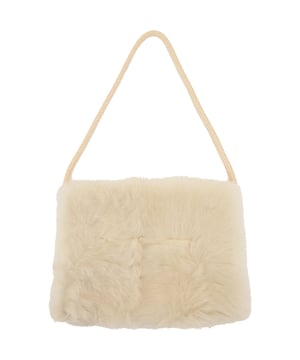 100% lambskin leather
Lining: 100% silk. Raeyâ€™s pocket muff is rendered in soft and fluffy shearling, made in the UK complete with a concealed zipped pocket ideal for small essentials.