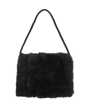 100% lambskin leather
Lining: 100% silk. Raeyâ€™s pocket muff is rendered in soft and fluffy shearling, made in the UK complete with a concealed zipped pocket ideal for small essentials.