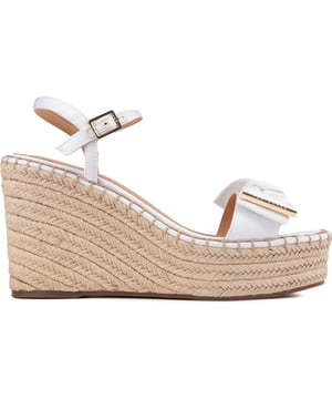 These Gia Bow platform wedges are beautiful, stylish summer sandals to elevate your outfit to new heights. Featuring a strappy white upper with a delicate buckle closure and ankle strap for a perfect, elegant fit. The gorgeous Ted Baker branded gold metal bow adds a touch of glam and the espadrille wedge sole a generous lift to your ensemble.