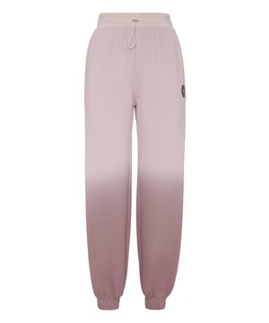 Estos pantalones de jogging son el complemento perfecto para alcanzar tus objetivos. Comodidad y rendimiento se complementan con el estilo Plein Sport.   Mezcla de algodón estampado   Estampado integral en degradé   Cintura elástica con cordón   Parche elástico en la pernera izquierda   Dos bolsillos con aberturas   Corte holgado   Puños elásticos en las perneras.