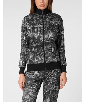 Check out the new tracksuit making your sports sessions and leisure time stand out.   All over printed triacetate fabric   The Brand is featured on the back of the top   Rubberized patch featuring the Brand emblem sewn on both jacket and pants   Zip fastener on jacket   Slit pockets   Rib knit hems