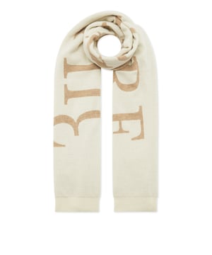 Complemente su look con esta bufanda de lana. Descubra más.  Punto liso de galga 12 de pura lana y cachemira.  Jacquard con letras de la marca tejidas con un hilo de color en contraste  Dobladillo con flecos  Tamaño: 32x180 cm